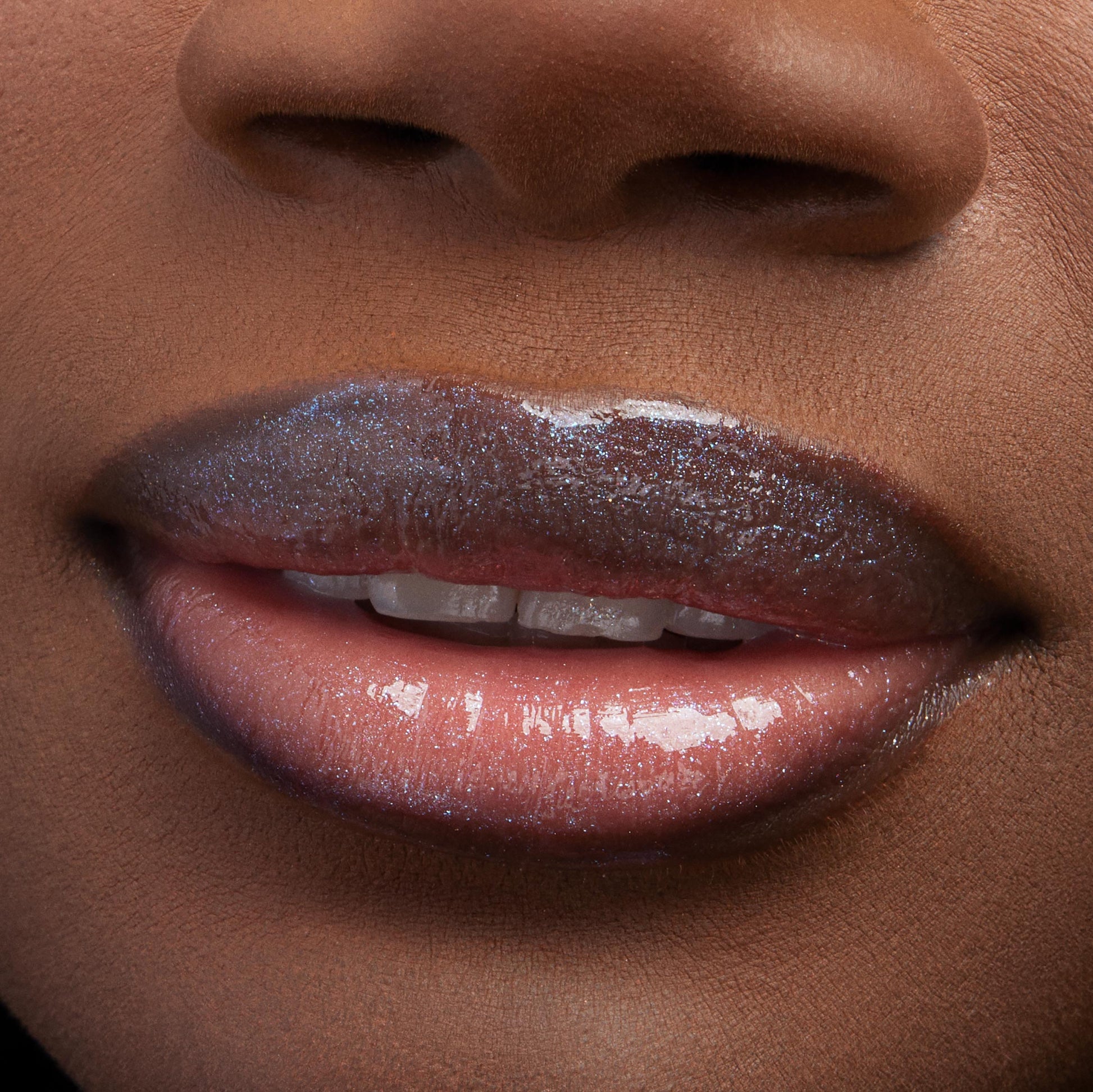 Lips wearing Favorite Deputy Ultra Glossy Lip gleam with a glassy, micro‑shimmer finish, reflecting light in a tight macro close-up that showcases the smooth, hydrated shine of ColourPop Ultra Glossy Lip.